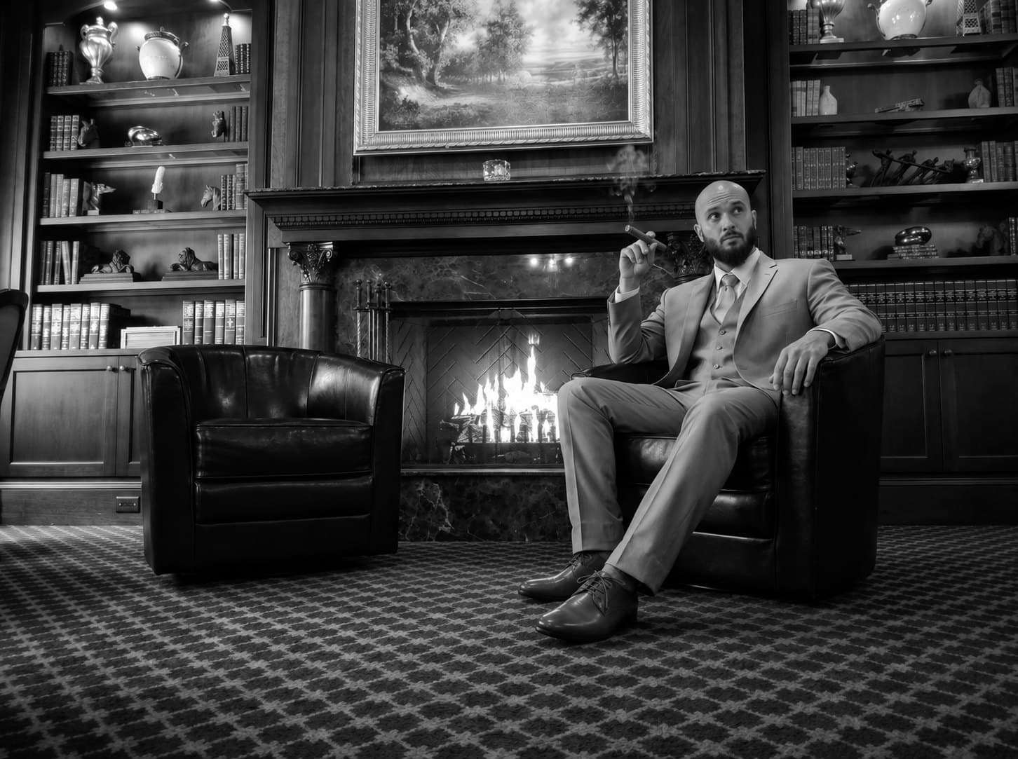 Neb (NebMeta / @CLOUD_STR1FE) in a suit by a fireplace, black and white